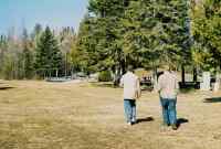 Eric and Dad walking through a cemetery.